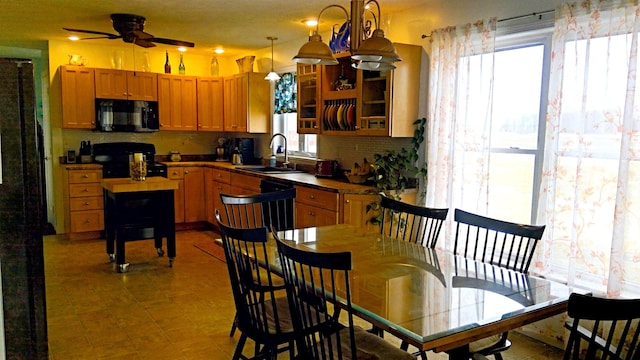 dining area with a ceiling fan