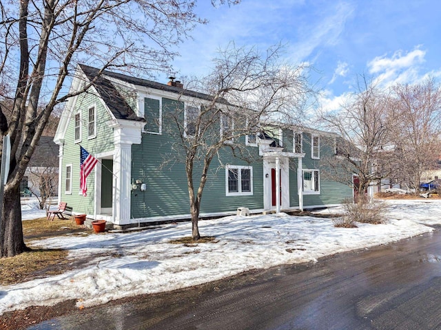 view of front of home with a chimney