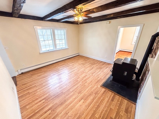 living room with beamed ceiling, a baseboard heating unit, light wood finished floors, baseboards, and ceiling fan