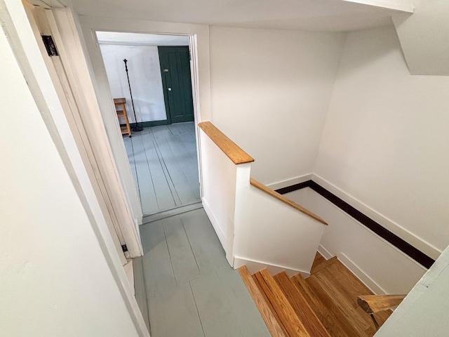 stairs with wood finished floors