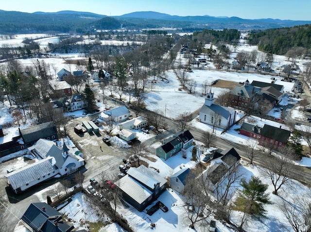 snowy aerial view featuring a mountain view