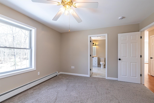 unfurnished bedroom featuring a ceiling fan, carpet, baseboards, ensuite bath, and baseboard heating