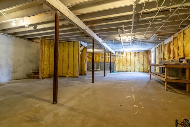 basement featuring stairs