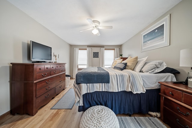 bedroom with light wood finished floors and a ceiling fan