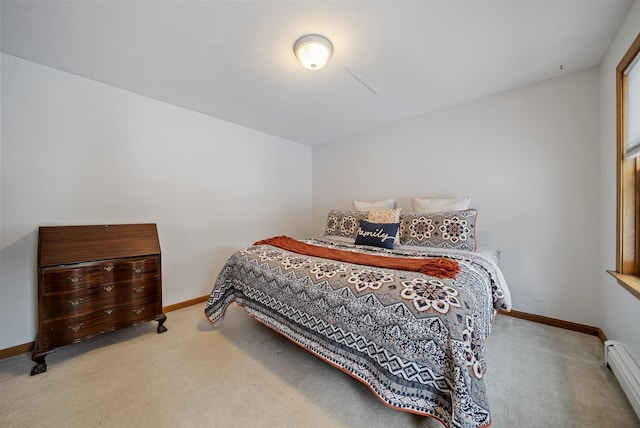 carpeted bedroom with baseboards and a baseboard radiator