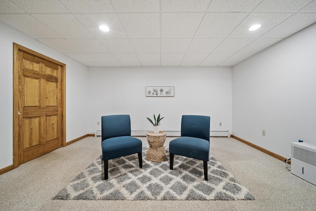 sitting room with recessed lighting, carpet, and baseboards