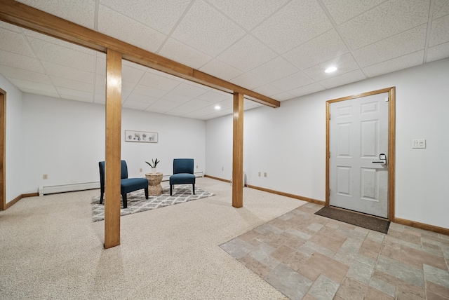 finished basement featuring recessed lighting, carpet, baseboards, and a baseboard radiator