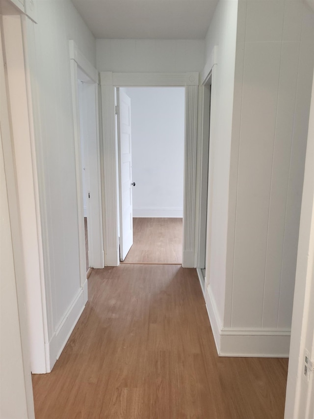 corridor with wood finished floors