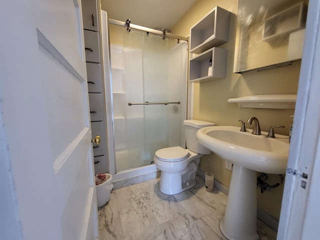 full bathroom with toilet, marble finish floor, and a shower stall