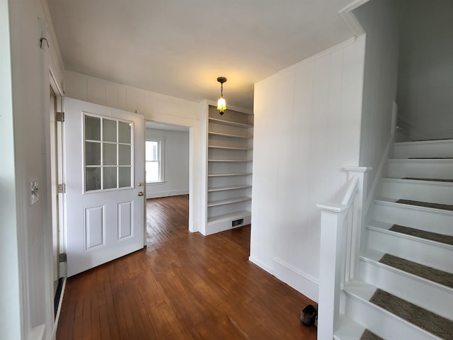 hall featuring stairway and dark wood-style flooring