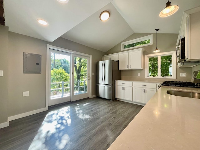 kitchen featuring white cabinetry, appliances with stainless steel finishes, dark wood-style floors, and a healthy amount of sunlight