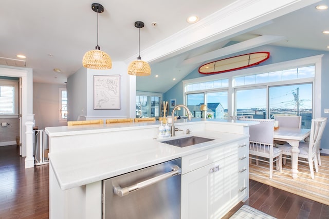 kitchen featuring dark wood-type flooring, a kitchen island with sink, a sink, white cabinets, and dishwasher