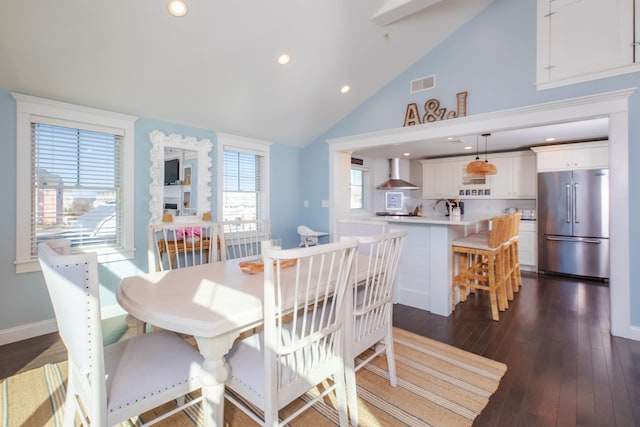 dining area with visible vents, high vaulted ceiling, dark wood finished floors, recessed lighting, and baseboards