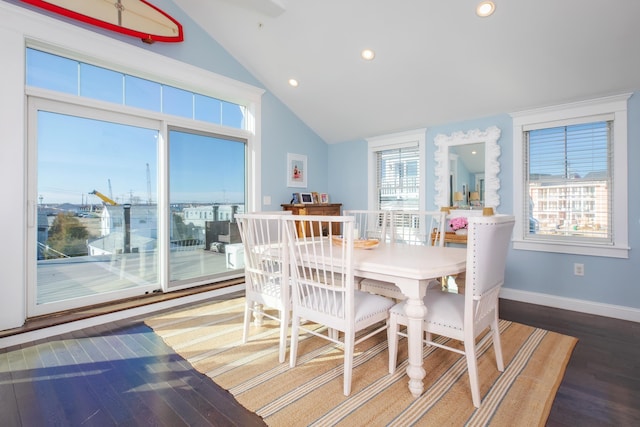 dining space featuring recessed lighting, baseboards, wood finished floors, and vaulted ceiling