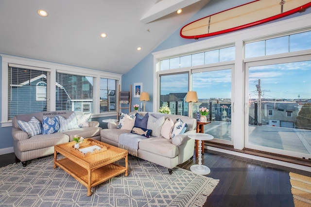 living area featuring recessed lighting, high vaulted ceiling, and wood finished floors