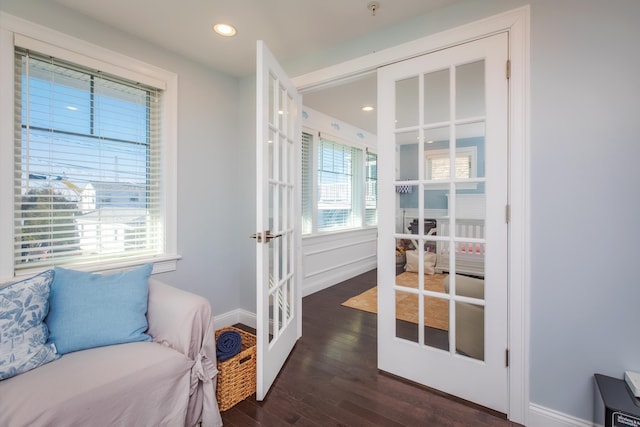 interior space featuring wood finished floors, recessed lighting, french doors, and baseboards