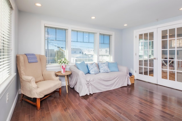 sitting room featuring wood finished floors, recessed lighting, a healthy amount of sunlight, and french doors