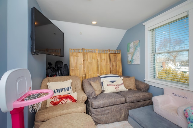 living room with recessed lighting and lofted ceiling