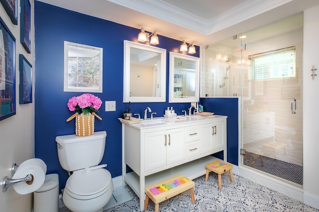 bathroom with crown molding, toilet, double vanity, a stall shower, and a sink