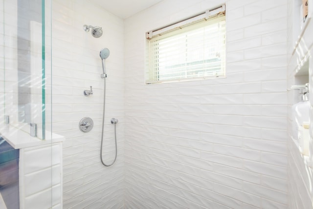 full bath featuring a tile shower