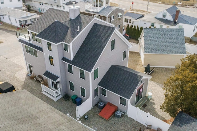 birds eye view of property with a residential view