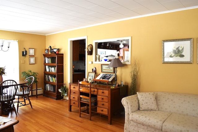 office area with crown molding and wood finished floors