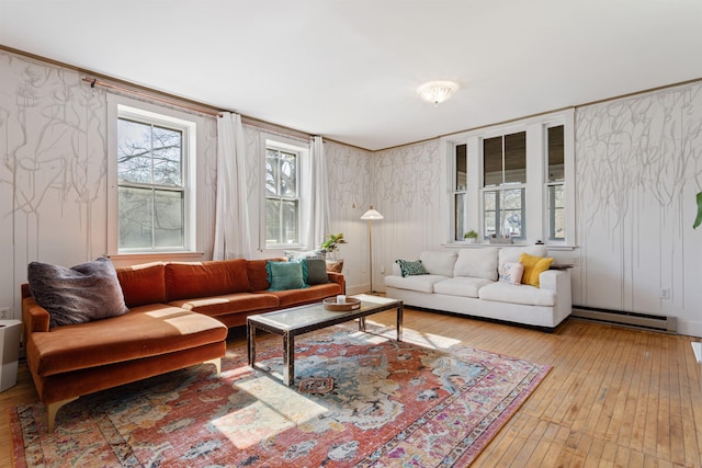 living area with wallpapered walls, wood-type flooring, and baseboard heating