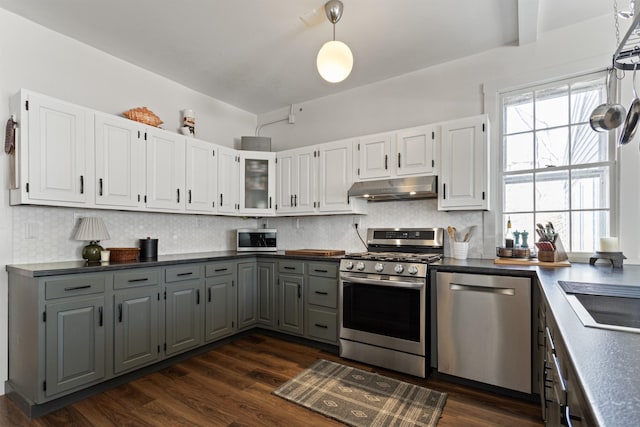 kitchen featuring white cabinets, gray cabinets, under cabinet range hood, and stainless steel appliances