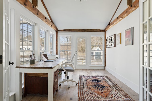 office space with hardwood / wood-style floors, vaulted ceiling with beams, and baseboards