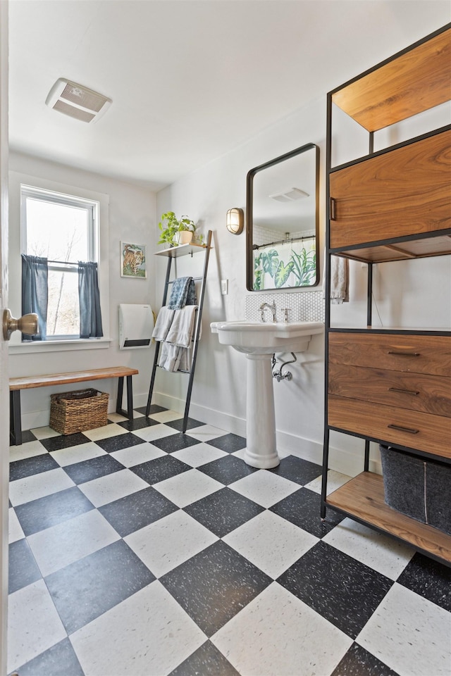 bathroom with tile patterned floors, visible vents, and baseboards