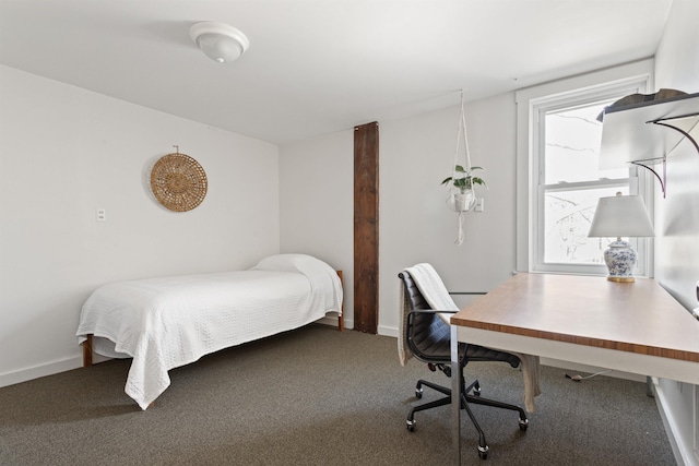 carpeted bedroom with baseboards