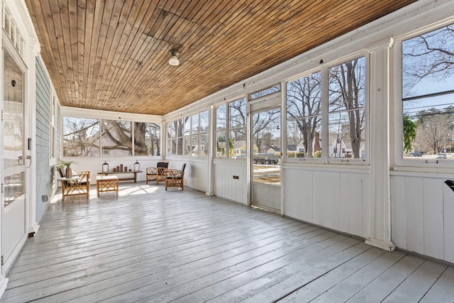 unfurnished sunroom featuring wooden ceiling