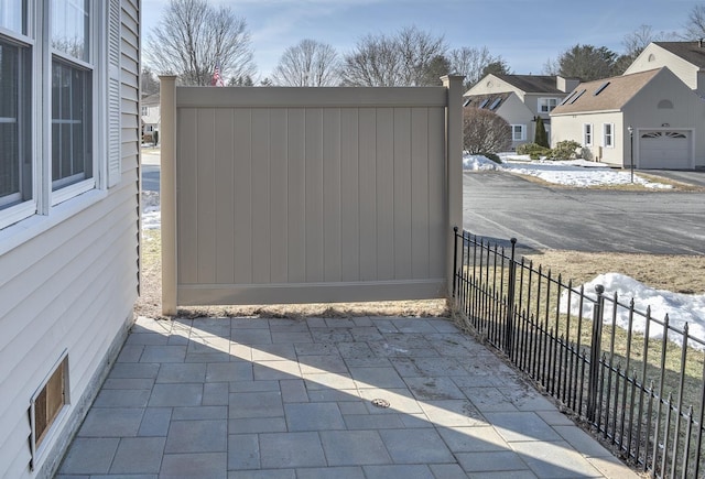 view of gate featuring a residential view and fence