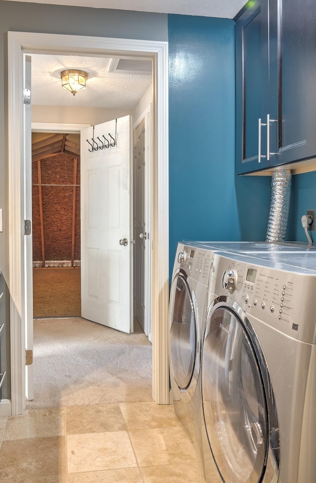 washroom featuring cabinet space, light colored carpet, and independent washer and dryer