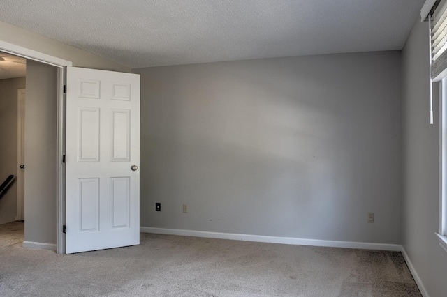 unfurnished bedroom with baseboards and carpet flooring