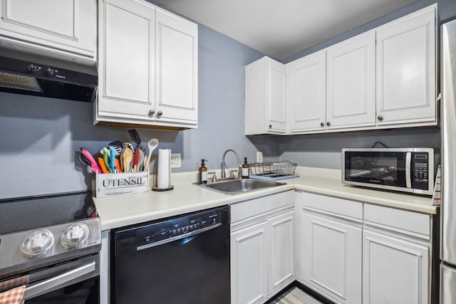 kitchen with white cabinets, appliances with stainless steel finishes, exhaust hood, and a sink