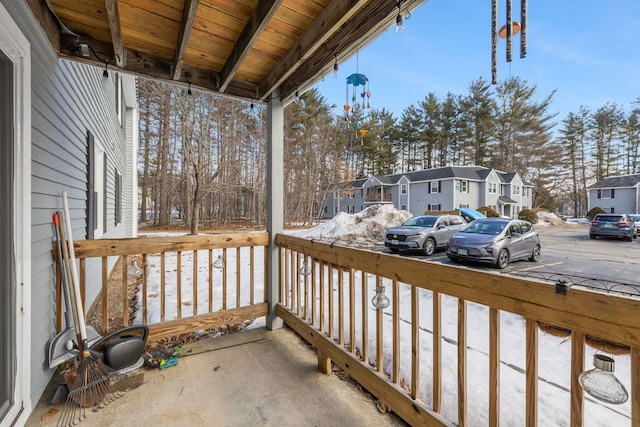 wooden deck with a residential view and a porch