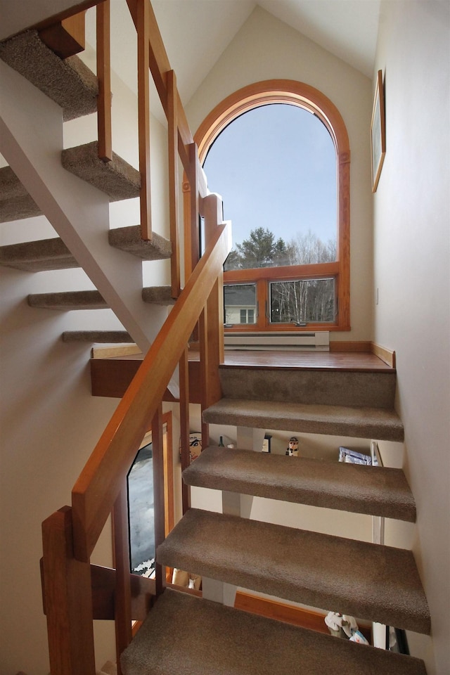 stairs with vaulted ceiling