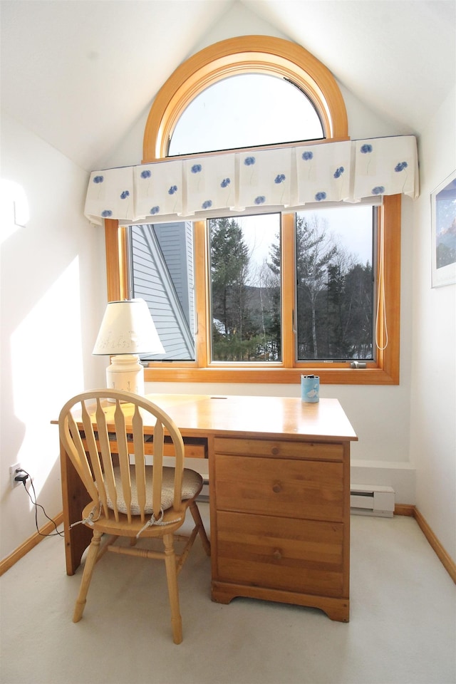 office space with lofted ceiling, baseboard heating, and a wealth of natural light