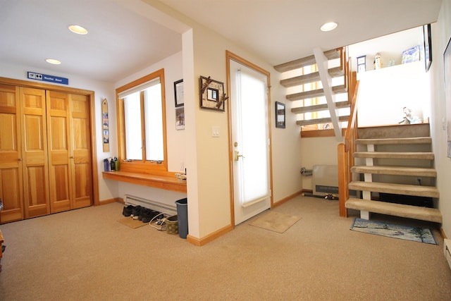 carpeted foyer with recessed lighting, stairway, and baseboards