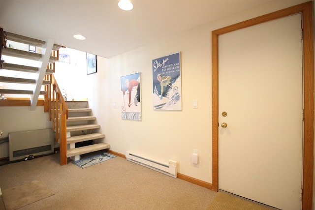 basement with stairway, baseboards, carpet, and a baseboard radiator