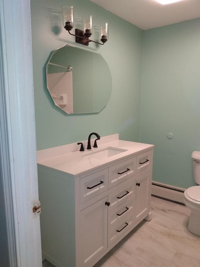 bathroom featuring a baseboard heating unit, toilet, and vanity