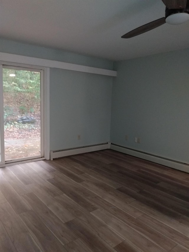 empty room with wood finished floors, a baseboard radiator, and ceiling fan