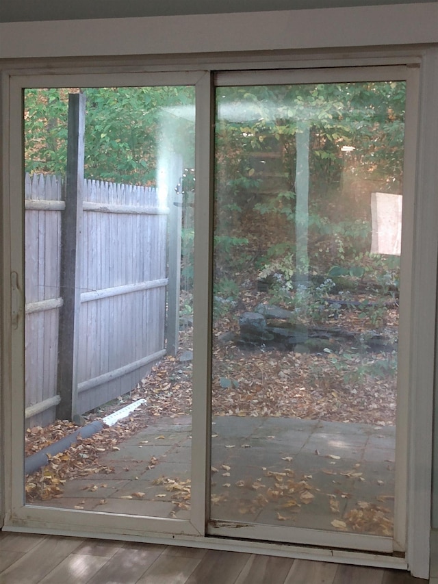 doorway to outside with wood finished floors