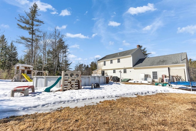 exterior space with a playground and a deck