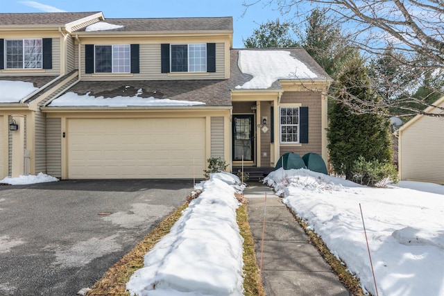 view of front facade with driveway and an attached garage