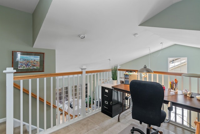 office space featuring a healthy amount of sunlight, lofted ceiling, and carpet floors