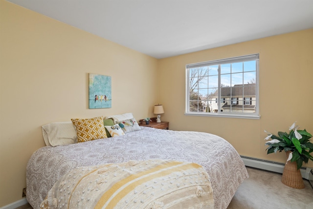 carpeted bedroom with a baseboard radiator