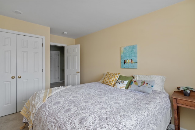 bedroom with a closet and carpet flooring