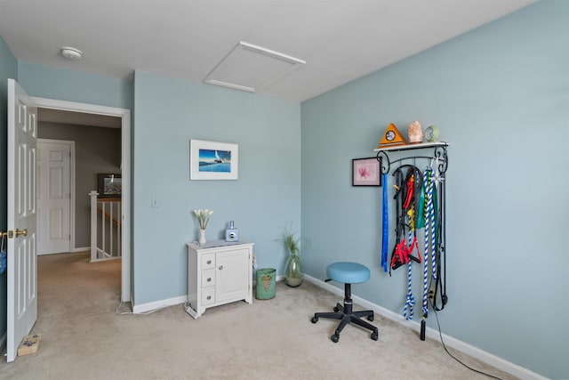 interior space featuring baseboards and attic access